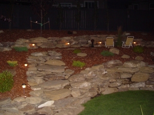 Incorporation of a "Low Voltage Lighting System" really brought this yard and the Natural Stone Retaining Walls to life after the sun went down
