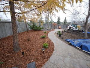 Mega-Libre (Toscana) Slab by Belgard Pathway leading out to the Patio and Pond area